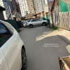 Дискомфортное соседство многоэтажек и частных домов в Иркутске. На улице...