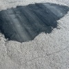 Машины прокатали дорогу на Пролетарской, 273/2, оставив после себя неровности...