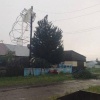 Теплицу намотало на опору во время урагана в Балахте