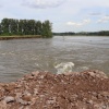 Работа по укреплению берега реки Абакан со стороны южной...
