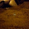 Минивэн провалился в яму на улице Петухова в Новосибирске